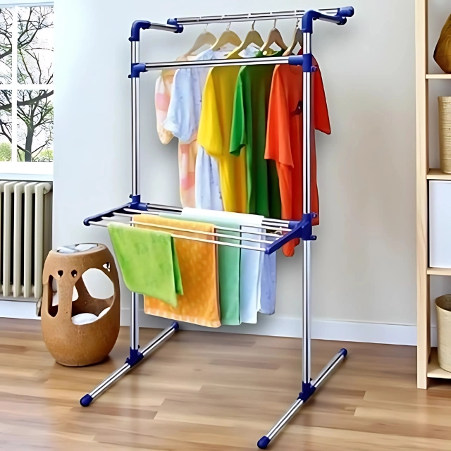 Portable Multifunctional Clothing and Drying Rack • Material: Stainless steel tube with engineering plastic components • Dimensions: 147 x 72 x 78 cm (H x W x D) • Maximum Weight Capacity: 15kg • Color: Blue accents • Storage: Foldable design for compact storage Features and Benefits • Premium Stainless Steel Construction – Built to last with corrosion-resistant materials that won’t rust or deteriorate over time • Space-Saving Foldable Design – Collapses flat for compact storage when not in use, perfect for small living spaces • Indoor/Outdoor Versatility – Use it anywhere from your apartment balcony to your laundry room or even while camping • Multiple Drying Configurations – Accommodates various garment types with flexible hanging options for shirts, pants, delicates, and bulky items • Generous Weight Capacity – Holds up to 15kg of wet laundry, equivalent to a full washing machine load • Eco-Friendly Air Drying – Reduces energy costs and extends clothing life by eliminating harsh heat damage Detailed Description This multifunctional drying rack combines durability with practicality, featuring a robust stainless steel frame that maintains its stability even when fully loaded. The engineering plastic components ensure smooth operation and long-lasting performance. Its thoughtful design includes multiple hanging levels and configurations, allowing you to maximize drying space while maintaining proper air circulation around your garments. The rack’s portability makes it ideal for apartment living, where outdoor drying isn’t always possible, or for travelers who need a reliable drying solution on the go. When laundry day is done, simply fold it down to a compact size that fits easily in closets, under beds, or behind doors. Specifications • Material: Stainless steel compound tube with engineering plastic components • Dimensions: 147 x 72 x 78 cm (H x W x D) • Maximum Weight Capacity: 15kg • Color: Blue accents • Storage: Foldable design for compact storage